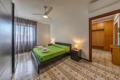 Letto o letti in una camera di CASA FRANCESCA Luminoso, Wifi e Parcheggio