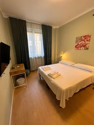 Letto o letti in una camera di Le Porte di Parma