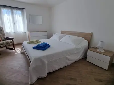 Letto o letti in una camera di Casa Nonna Maria - Val Fontanabuona