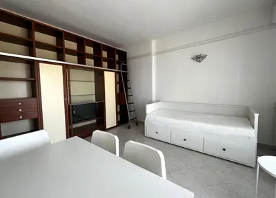 Letto o letti in una camera di Bilocale con parcheggio privato vicino la stazione