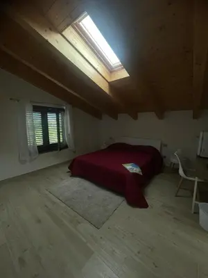 Letto o letti in una camera di La Macchia