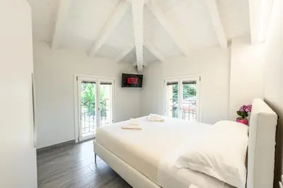 Letto o letti in una camera di Villa Turrini