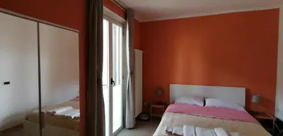 Letto o letti in una camera di B8 Parma