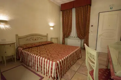 Letto o letti in una camera di Hotel Adda