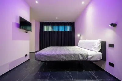 Letto o letti in una camera di Punto Zero Lux il primo boutique concept a Reggio Emilia