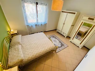 Letto o letti in una camera di L' altro nido