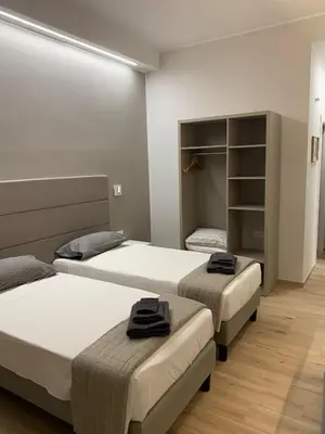 Letto o letti in una camera di Fla Rooms