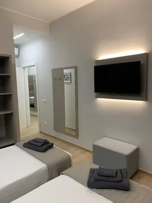 Letto o letti in una camera di Fla Rooms