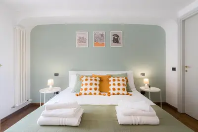 Letto o letti in una camera di DUOMO Relax in centro, WiFi, Aria Condizionata