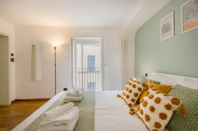 Letto o letti in una camera di DUOMO Relax in centro, WiFi, Aria Condizionata