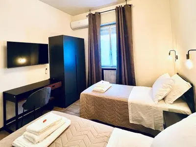 Letto o letti in una camera di Casa Margherita