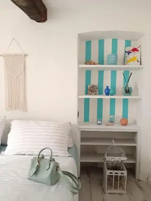 Letto o letti in una camera di Casa Martina