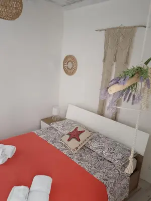 Letto o letti in una camera di Casa Martina