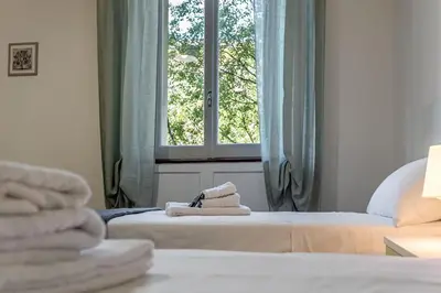 Letto o letti in una camera di FERRARI - Stazione e centro città