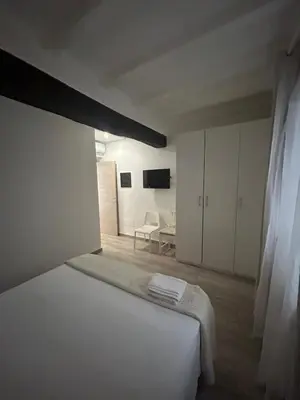 Letto o letti in una camera di Borgo Guazzo Flat