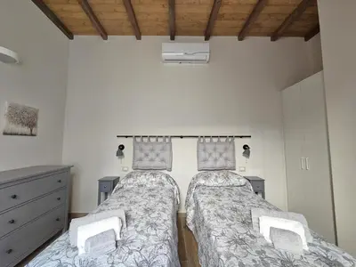 Letto o letti in una camera di Patrizio Apartments-by Goccia di Lago