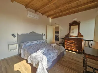 Letto o letti in una camera di Patrizio Apartments-by Goccia di Lago