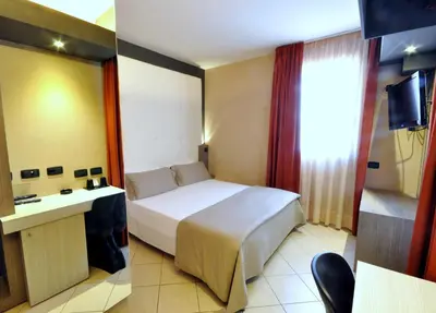 Letto o letti in una camera di Planet Hotel