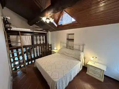 Letto o letti in una camera di La Casina