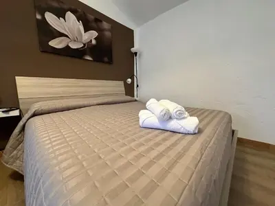 Letto o letti in una camera di B&B Ronco Oste