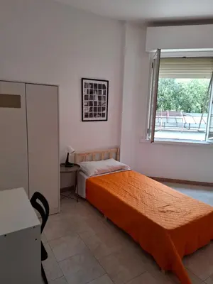 Letto o letti in una camera di FARE BnB - Room Porta Castello