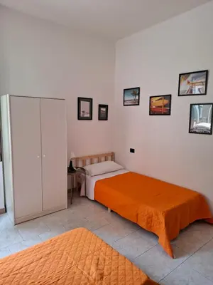 Letto o letti in una camera di FARE BnB - Room Porta Castello