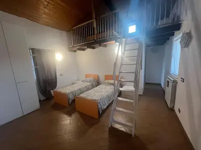 Letto o letti in una camera di Nido nel verde