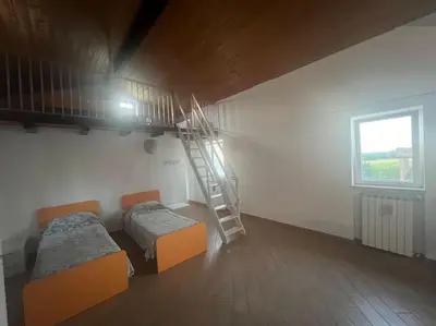 Letto o letti in una camera di Nido nel verde