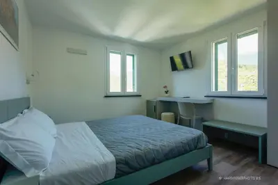 Letto o letti in una camera di Affittacamere MontAle