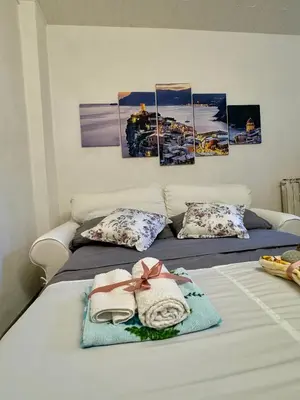 Letto o letti in una camera di Appartamento dal monumento