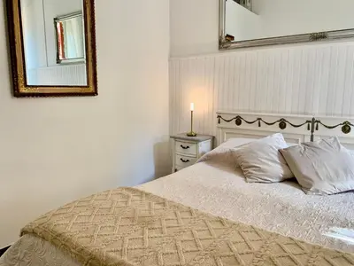 Letto o letti in una camera di Casa Adele