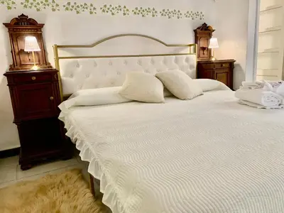 Letto o letti in una camera di Casa Adele