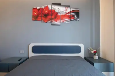 Letto o letti in una camera di 243b - Appartamento Mignon - Sara Home Chiavari, 200metri dal Mare