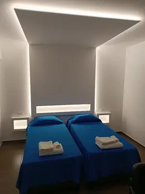 Letto o letti in una camera di CIVICO 14 Holiday Rooms