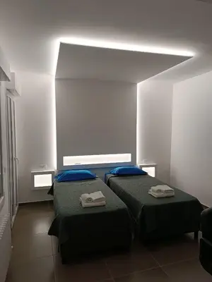Letto o letti in una camera di CIVICO 14 Holiday Rooms