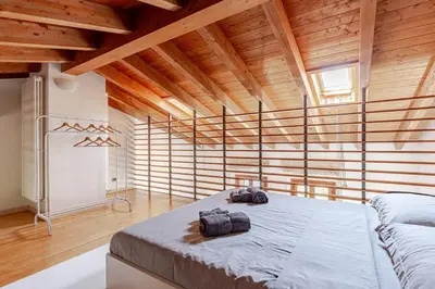 Letto o letti in una camera di Piacenza Open Space