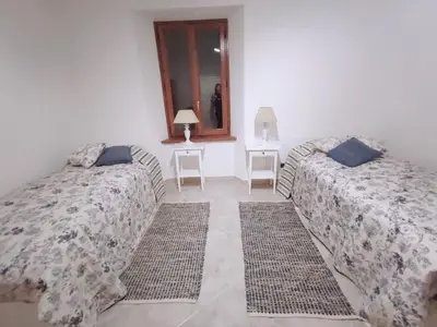 Letto o letti in una camera di House Oleander in der Toskana - Bigliolo - mit viel Sonne, Garten, Balkon und Terrasse