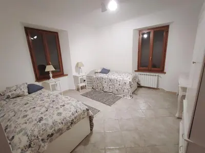 Letto o letti in una camera di House Oleander in der Toskana - Bigliolo - mit viel Sonne, Garten, Balkon und Terrasse