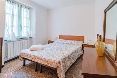 Letto o letti in una camera di 139b - Casa Santa Vittoria, 10 minuti dal mare e spiaggia di Sestri Levante