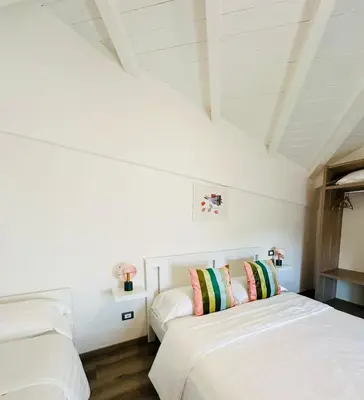 Letto o letti in una camera di Giardini B&B