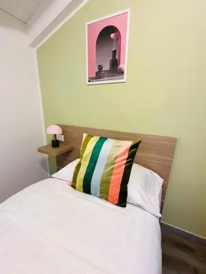 Letto o letti in una camera di Giardini B&B