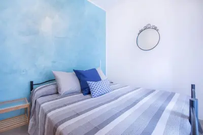 Letto o letti in una camera di Guesthouse La Bonaccia