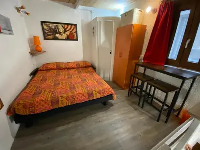 Letto o letti in una camera di Mini House centro storico Duomo di Pavia