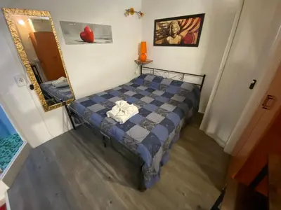 Letto o letti in una camera di Mini House centro storico Duomo di Pavia