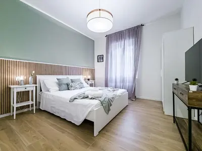 Letto o letti in una camera di Motor Valley Boutique Apartment - 3 Suites