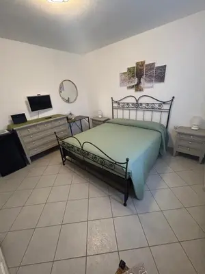 Letto o letti in una camera di Ca' Martina