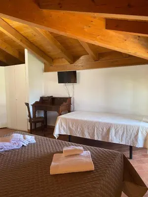 Letto o letti in una camera di Foresteria dell'Errante