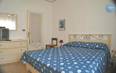 Letto o letti in una camera di Lombardi Abbeveratoia