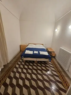 Letto o letti in una camera di Casa Via Poggiali