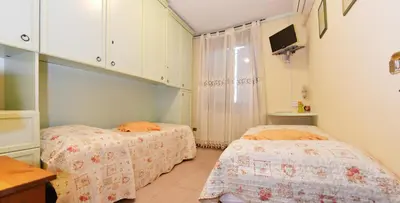 Letto o letti in una camera di B&B Il Pavone